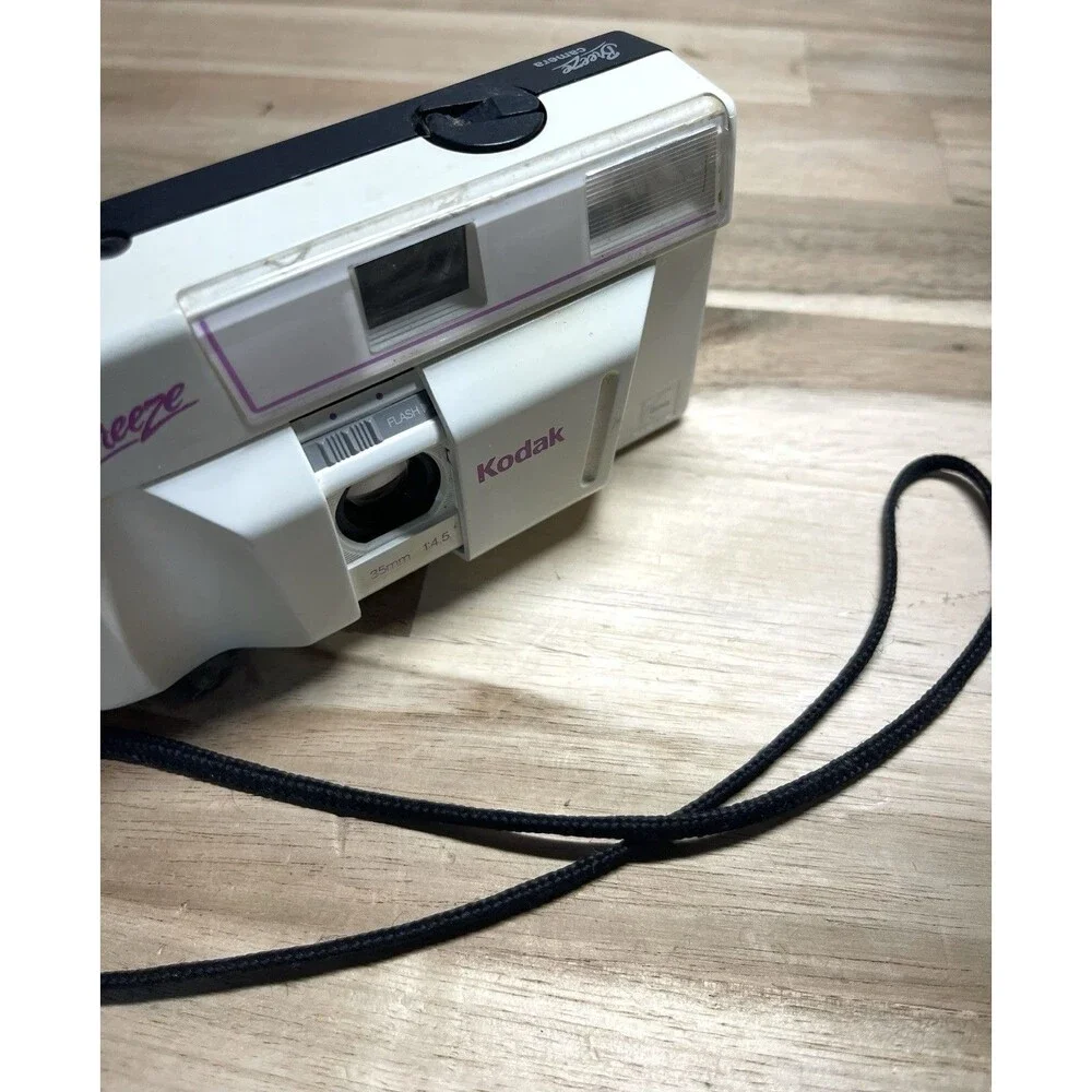 Kodak White Breeze Point-and-Shoot Camera with Black Strap and Pink Accents